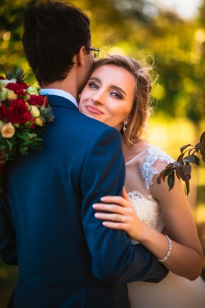bride and groom on background summer forest.の写真素材