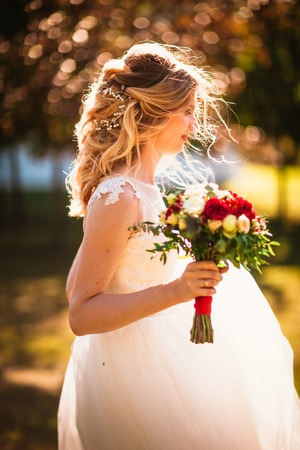 beautiful young bride in the garden background.の写真素材