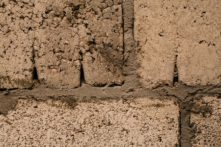 dark orange beige brick with cement close-up.の写真素材