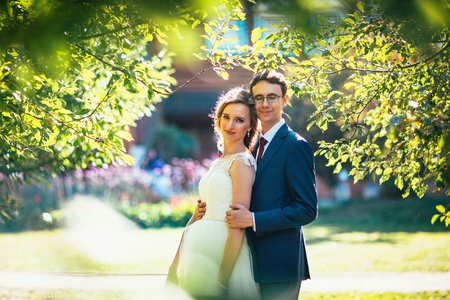 bride and groom on background summer forest.の写真素材