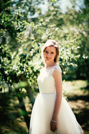 beautiful young bride in the garden background.の写真素材