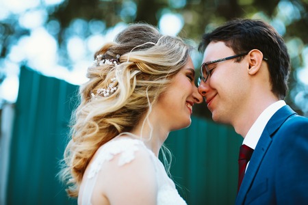Beautiful stylish bride and groom on garden background.の写真素材