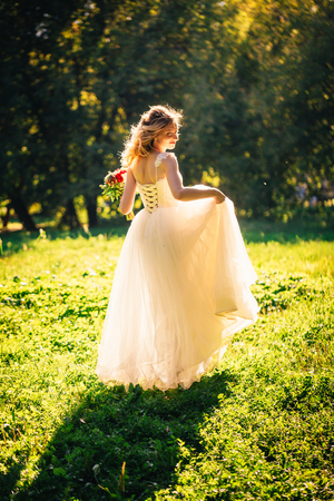 beautiful young bride in the garden background.の写真素材