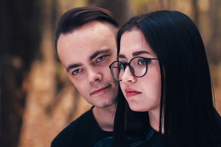 man and woman in the autumn forestの写真素材