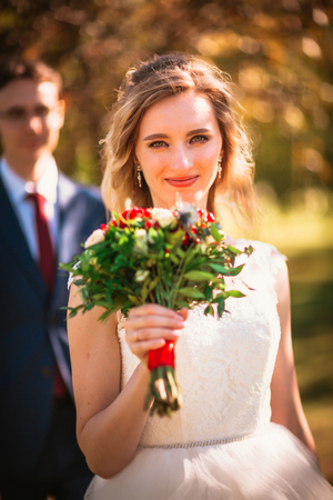 bride and groom on background summer forest.の写真素材