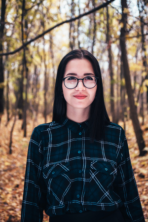 portrait of a young woman in the autumn forest.の写真素材
