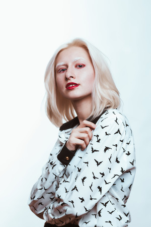 portrait blonde albino girl in studio on white background.の写真素材