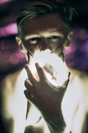 Portrait man Strip Light LED tape on dark color background.の写真素材