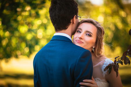 bride and groom on background summer forest.の写真素材