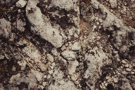 burnt dark detailed stone texture close up.の写真素材