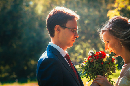 bride and groom on background summer forest.の写真素材