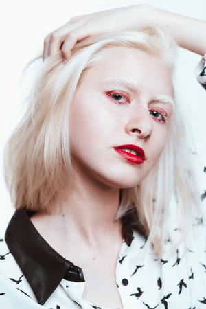 portrait blonde albino girl in studio on white background.の写真素材