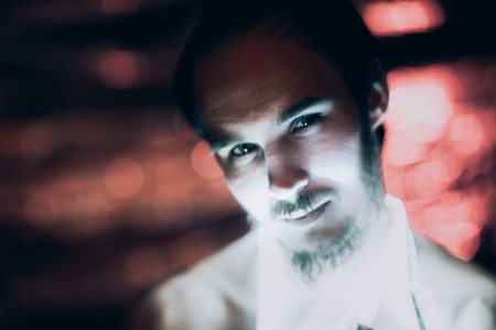 Portrait man Strip Light LED tape on dark color background.の写真素材