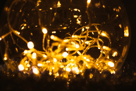 Christmas luminous garland on a dark background.の写真素材