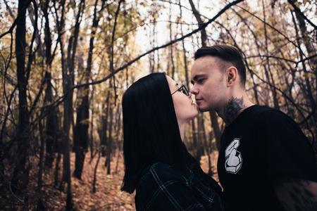 man and woman in the autumn forestの写真素材