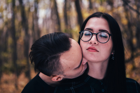 man and woman in the autumn forestの写真素材