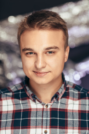 portrait of a young man on a blurred background.の写真素材