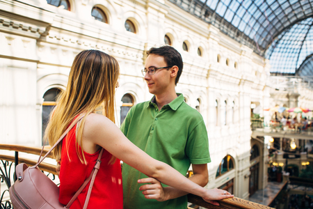 girl and guy stand on the background of the bridgeの写真素材