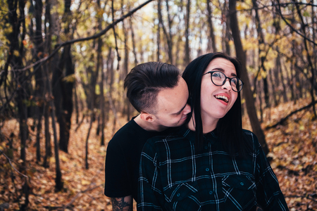 man and woman in the autumn forestの写真素材