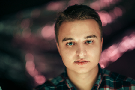 portrait of a young man on a blurred background.の写真素材