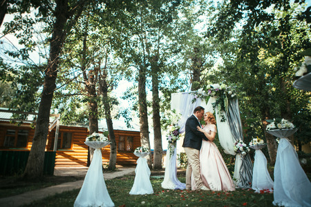 bride and groom on wedding ceremony on background nature.の写真素材