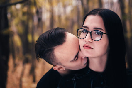 man and woman in the autumn forestの写真素材