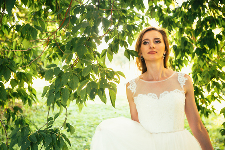 beautiful young bride in the garden background.の写真素材
