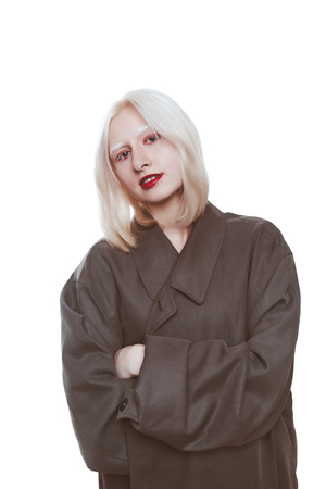 portrait of an albino girl in a raincoat in the studio.の写真素材