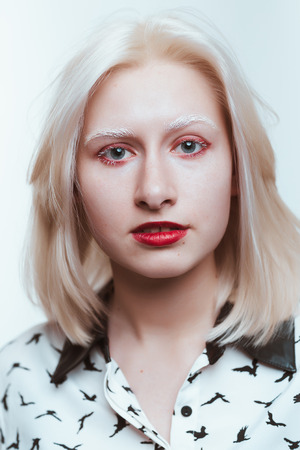 portrait blonde albino girl in studio on white background.の写真素材