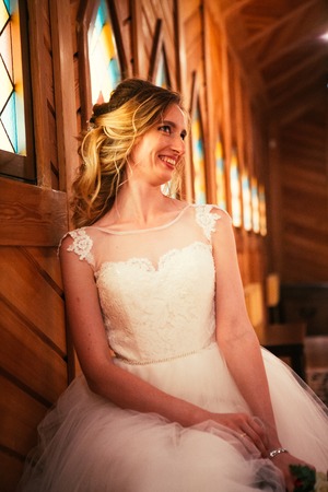 Portrait young beauty bride near the window.の写真素材