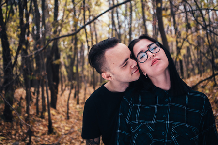 man and woman in the autumn forestの写真素材