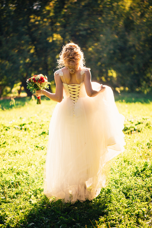 beautiful young bride in the garden background.の写真素材