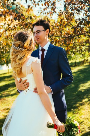 bride and groom on background summer forest.の写真素材