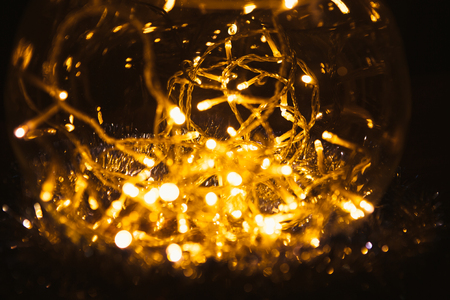 Christmas luminous garland on a dark background.の写真素材