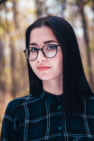 portrait of a young woman in the autumn forest.の写真素材