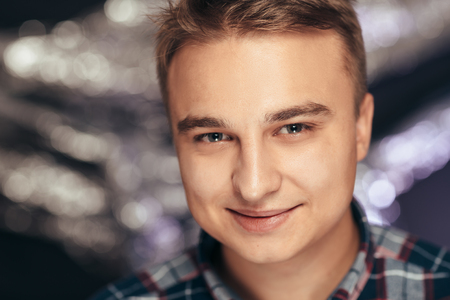 portrait of a young man on a blurred background.の写真素材