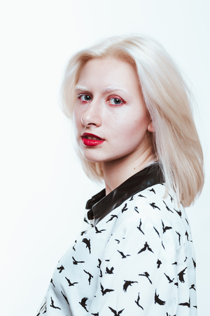 portrait blonde albino girl in studio on white background.の写真素材