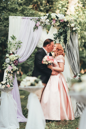 bride and groom on wedding ceremony on background nature.の写真素材