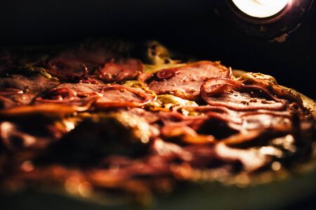 Pizza baked in an electric oven close-up.の写真素材