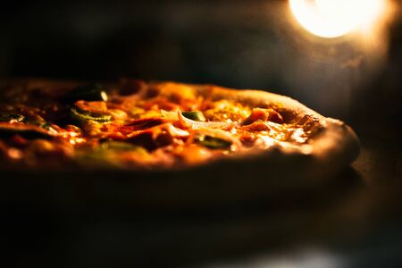 Pizza baked in an electric oven close-up.の写真素材