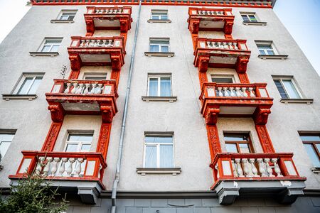 white building with red balconiesの写真素材