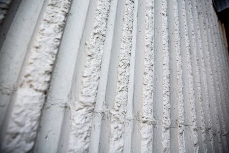 white ruined stone wall verticalの写真素材