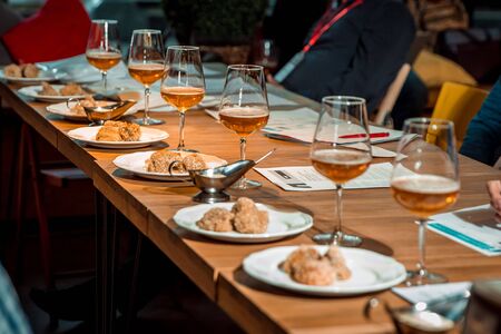 food in plates on a table with wineの写真素材