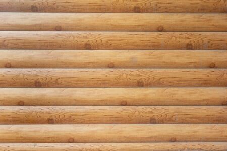 wooden logs horizontal masonry on the streetの写真素材