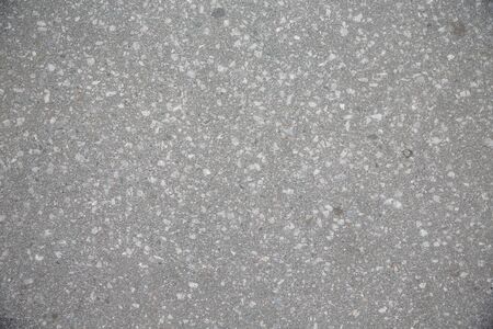 asphalt with white gravel on the streetの写真素材