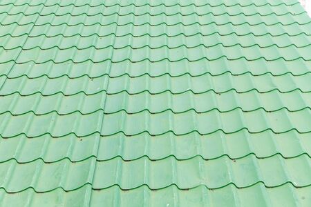 green metal roof tiles. metal tile on the streetの写真素材