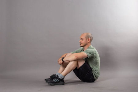 young bald man studio shotの写真素材