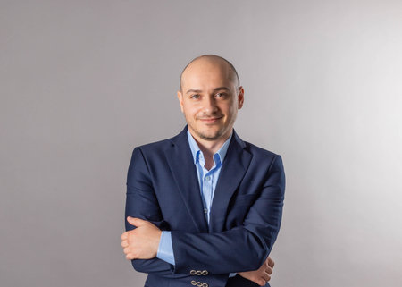 young bald man studio shotの写真素材