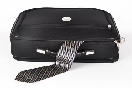 Picture of suitcase of with sticking out by a masculine tie on a white backgroundの写真素材