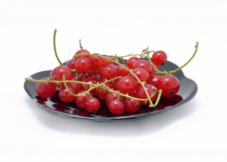 Picture of clusters of red currant on a white background